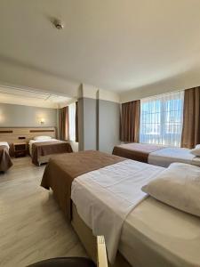 a hotel room with two beds and a window at Gold Hotel in Istanbul +139 photos