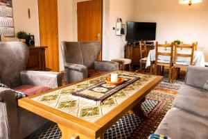 a living room with a table and chairs at Ferienhaus Klaus in Berumbur