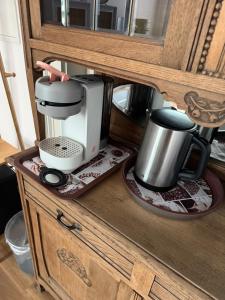 a counter with a coffee maker and a coffee pot at Elfenvilla in Erkelenz