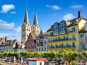a group of buildings in a town with a church at Ferienwohnung Boppard in Boppard