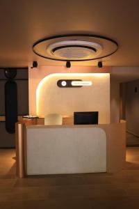 a room with a counter with a light on it at Better Suites Hotel in Meppādi