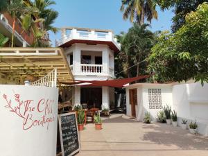 a building with a sign in front of it at The cliff boutique in Varkala