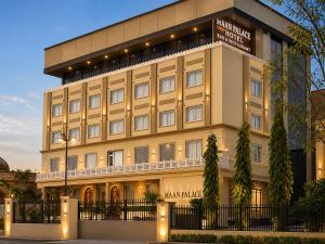 a large building with a sign on it at The Grand Maan Palace and Resort- Near Vaishali Nagar I New Building in Jaipur