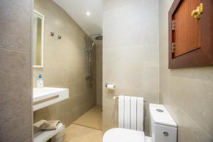 a bathroom with a toilet and a sink at Cala Figuera Studio 5b in Cala Figuera +14 photos