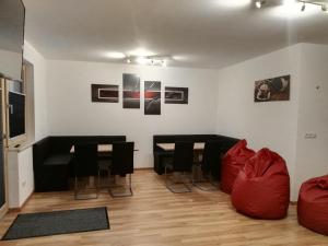 a living room with a couch and a table and chairs at Ferienwohnung Mair in Umhausen +27 photos