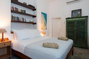 a bedroom with a bed with two pillows on it at Niokratis in Áno Petálion