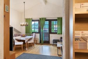 a kitchen and dining room with a table and chairs at Appartement Azalea Oetz in Oetz