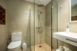 a bathroom with a shower and a toilet and a sink at Cala Figuera Apartment 3b in Cala Figuera +14 photos