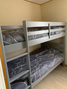 a bunk bed room with two bunk beds at Gîte du Phare in Lanquais