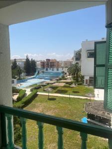a view of a pool from a balcony at S1 a louer in Dar el Saïd
