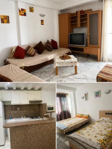 a living room with two beds and a tv at S1 a louer in Dar el Saïd +2 photos