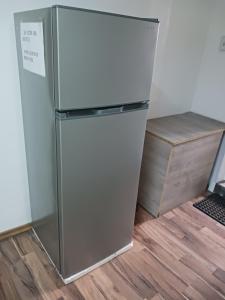 a refrigerator in a room with a wooden floor at Hostel Center Plovdiv in Plovdiv