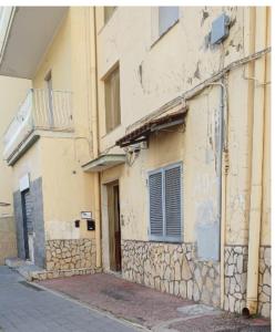an old building on the side of a street at Ai Vecchi mulini in Gragnano +5 photos
