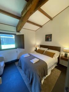 a bedroom with a large bed in a room at Casas do Campo in Monfero +51 photos