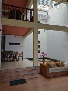 a living room with a couch and a table at LP Residence in Pannipitiya