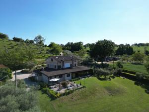 an aerial view of a house on a hill at Gastronomic Country House CarloCarla in Monte San Pietrangeli