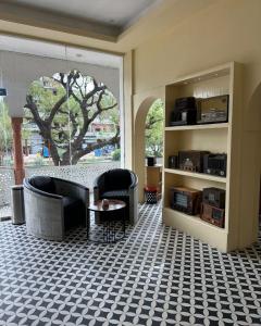 a living room with a couch and a table at Laal Haveli Kukas in Jaipur