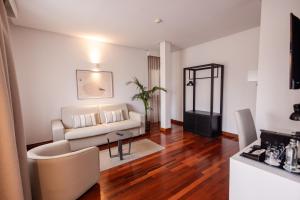 a living room with a couch and a table at Hotel Escuela Santa Brígida in Santa Brígida