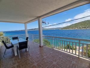 a balcony with a view of the water at Panorama in Drvenik Veli