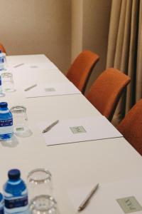a group of tables with bottles of water on them at Hotel Pax Atocha in Madrid