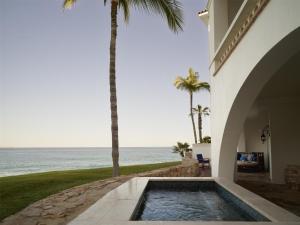 a house with a swimming pool next to the ocean at One&Only Palmilla in San José del Cabo +262 photos