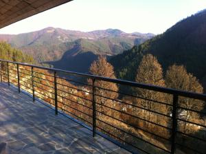 a balcony with a view of the mountains at Sabri's Penthouse in Ogled