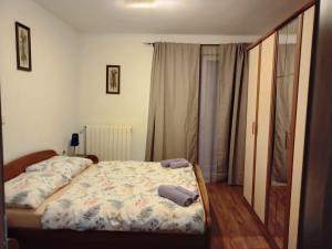 a bedroom with a bed with two pillows on it at Villa Meja in Hreljin +46 photos