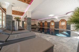 an indoor swimming pool in a house at Natur & Alpinhotel Post in Vent