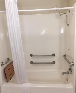 a bathroom with a shower and a bath tub at Country Inn & Suites by Radisson, Bel Air-Aberdeen, MD in Bel Air