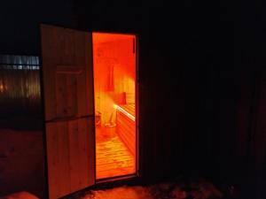 an open door to a bathroom with a toilet at APARAN House in Aparan