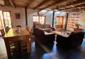a living room with a couch and a table at Wunderschönes Haus mit großer Terrasse in Sauce
