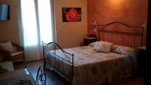 Postel nebo postele na pokoji v ubytování B&B Il Feriolo