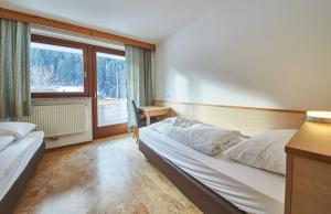 Ένα ή περισσότερα κρεβάτια σε δωμάτιο στο Appartements Glemmtal