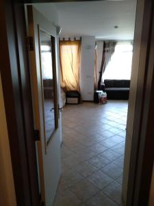 a hallway with a living room with a couch at Oasis Resort&Spa Lozenets Studio 12 in Lozenets