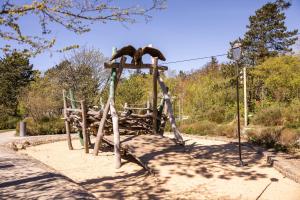 a wooden structure with two bears on top of it at Strandnahe Ferienwohnung mit Privatweg, Spielplatz & Aufzug in Sankt Peter-Ording