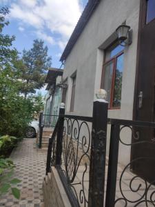 a black fence in front of a house at сой333 in Navoi +8 photos