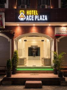 a hotel ace plaza at night with a sign at Hotel Ace Plaza in Udaipur