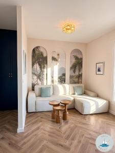 a living room with two beds and a table at NAVU Apartment in Katun +50 photos