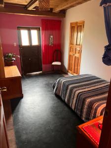 a bedroom with a bed and a window and a door at Wunderschönes Haus mit großer Terrasse in Sauce