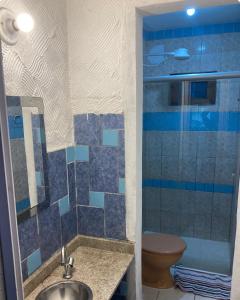 a bathroom with a sink and a toilet at Makana Surf Camp in Ubatuba