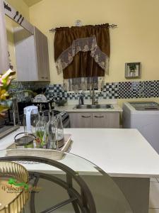 a kitchen with a sink and a counter top at Phoenix Eden in Portmore