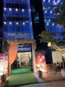 a store front with an orange curtain and a window at Bisaka Hotels in Patna