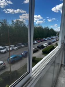 a window with a view of a parking lot at VG-Apartment in Košice