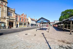 an empty street in a city with buildings at Bedford Retreat in Bedford +11 photos