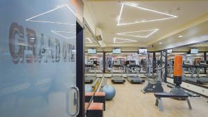 a gym with several treadmills and machines in it at واحد لواحد للشقق المخدومة -اقتصادي in Al Khobar