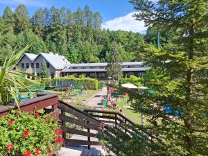 a resort with a playground in the mountains at Ośrodek Wypoczynkowy Niagara in Międzybrodzie Żywieckie