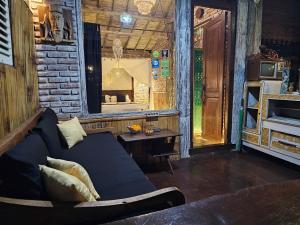 a living room with a couch and a table at Santhiku Hotel & SPA in Lovina