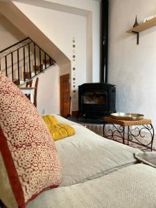 a bedroom with a bed and a fireplace in a room at Peaceful Townhouse Retreat in Órgiva