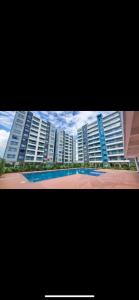 a view of a large apartment building with a basketball court at Airport Studio Gym pool fast WIFI Ideal for digital nomads Syokimau in Syokimau