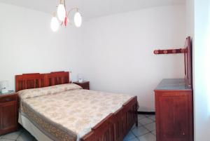A bed or beds in a room at Ferrando Apartment